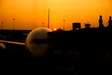 Silhouette Of Airplane On Airport During Sunset