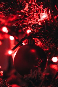 Red Bauble Attached On A Pre-lit Tree