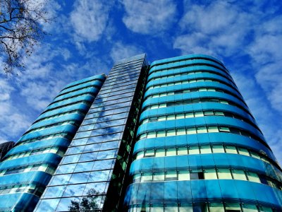 Low Angle Photography Of Blue Tinted Glass Buildings photo