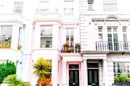 Architectural Photography Of White And Pink High-rise Building