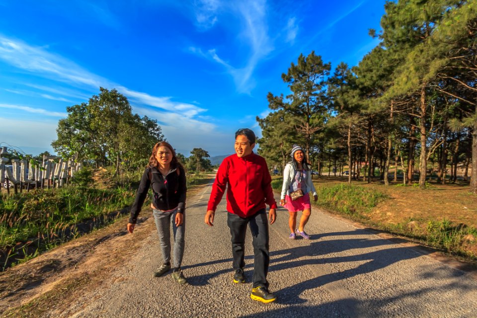 Man And Two Women Walking