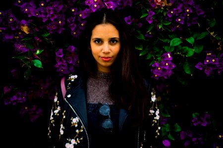 Woman Standing Near Purple Flowers photo