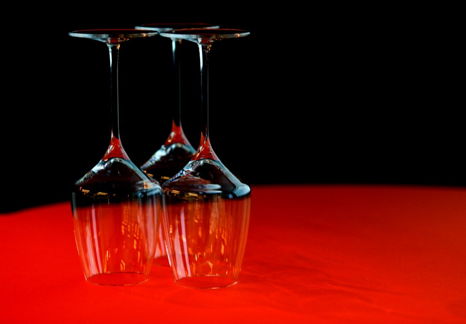 Three Wine Glass On Red Surface
