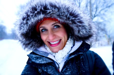 Close Up Photo Of Woman Wearing Black Zip-up Parka Coat During Snow Season photo