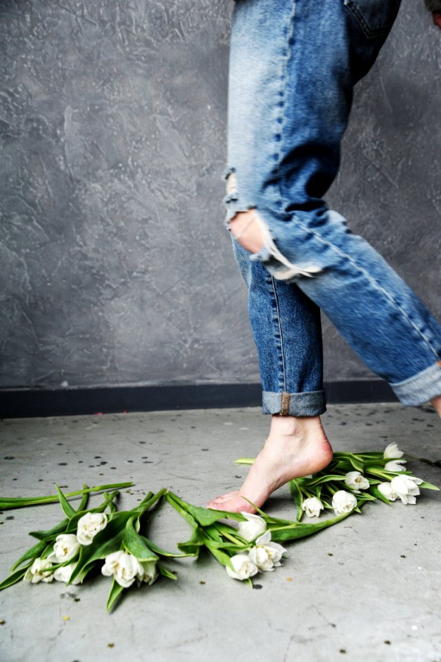 Person In Blue Ripped Jeans