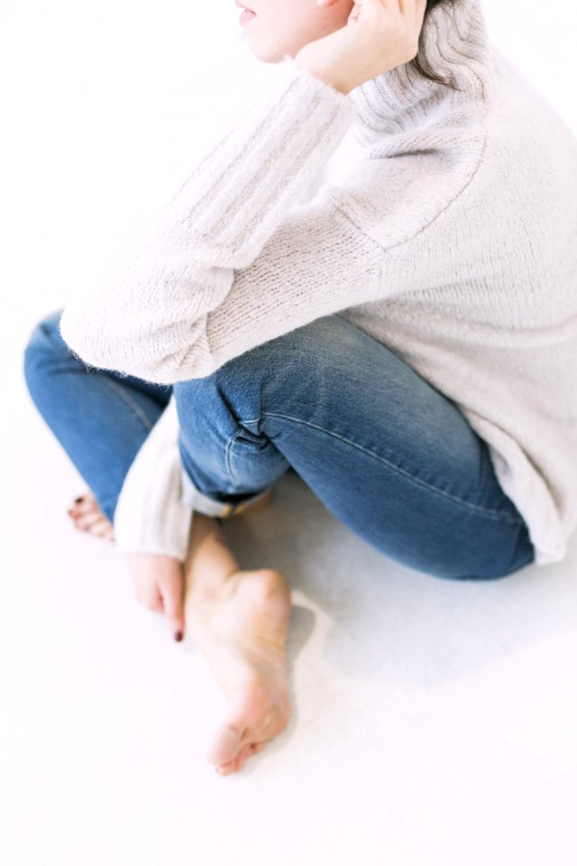 Woman In Gray Sweater And Blue Denim Jeans