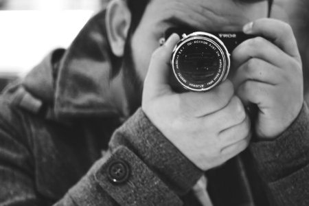 Man Taking Photo Using Black Dslr Camera photo