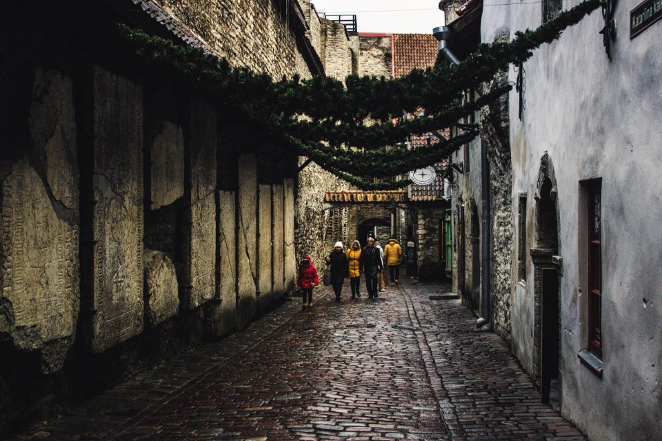 People On The Street Between Houses