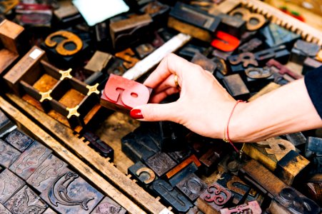 Person Holding Red Wooden Letter A Ornament