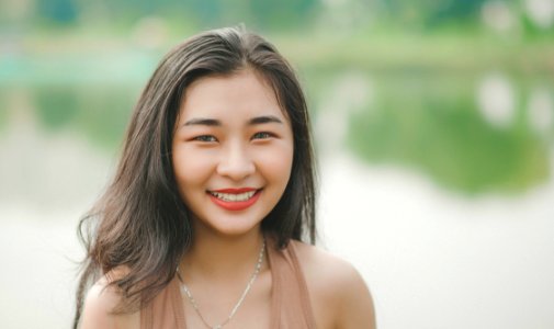 Close-Up Photography Of A Girl Smiling photo