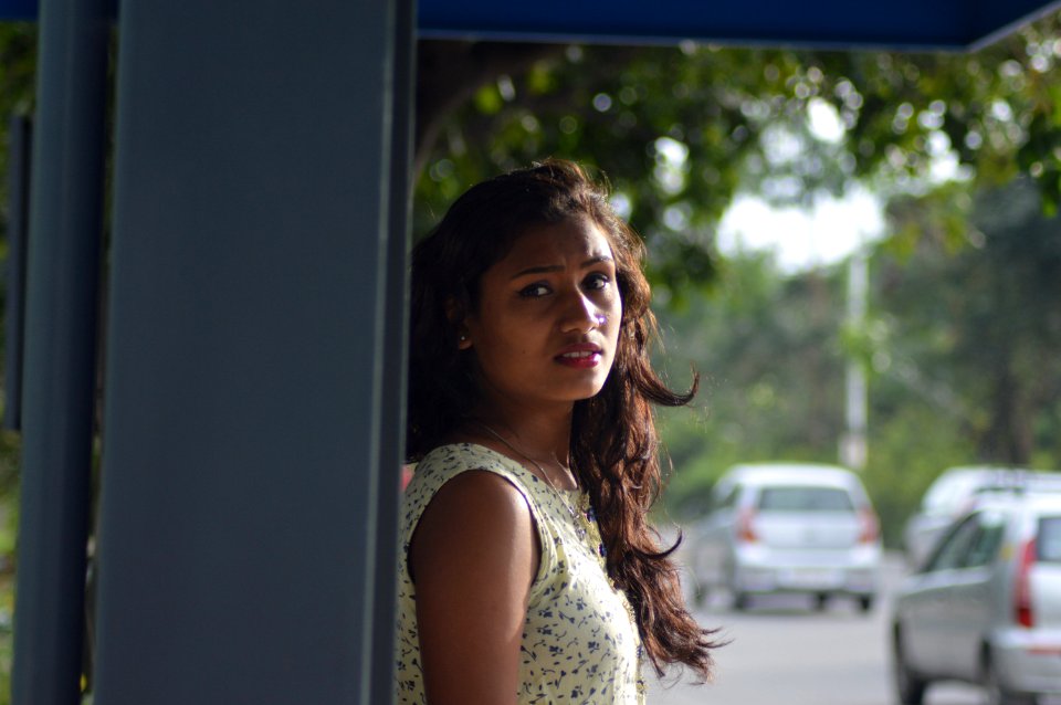 Photo Of Woman In White Blouse Leaning On Gray Steel Shed