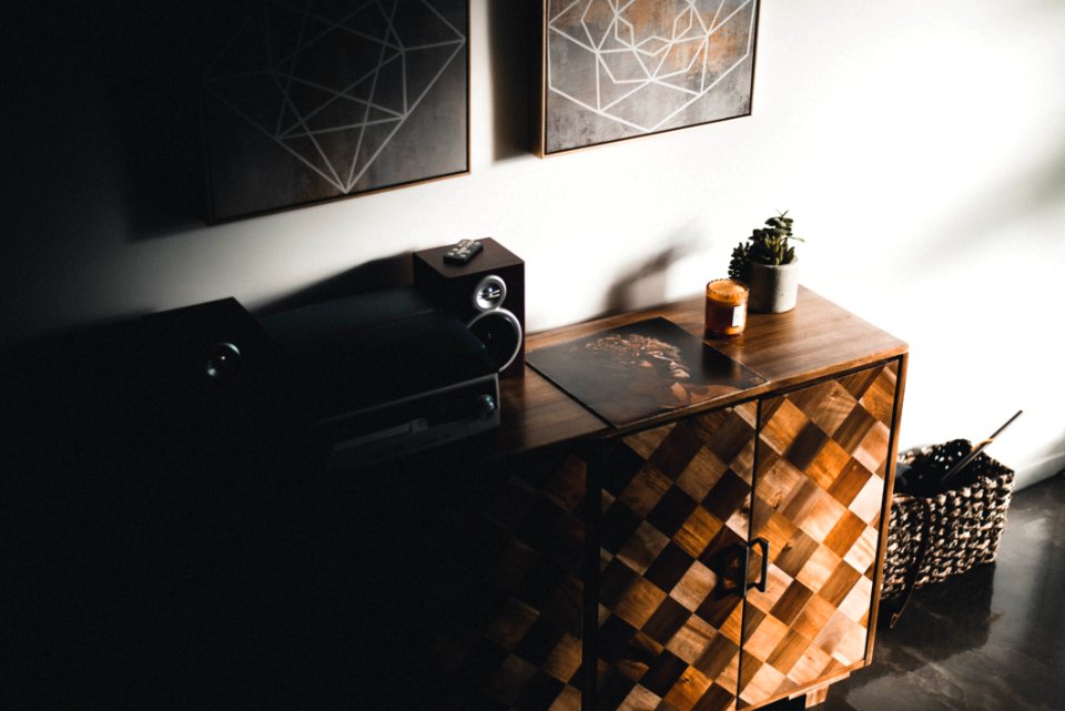Black Stereo Component On Brown Wooden Dresser Console