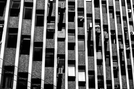 Gray Scale Photo Of High-rise Building photo