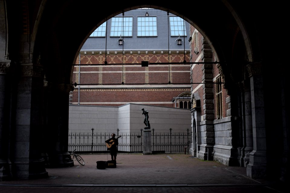 Person Playing Guitar On Street