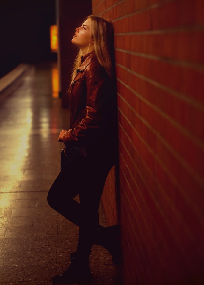 Woman Leaning On Wall