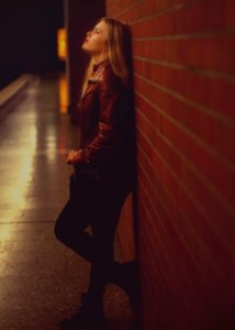 Woman Leaning On Wall photo