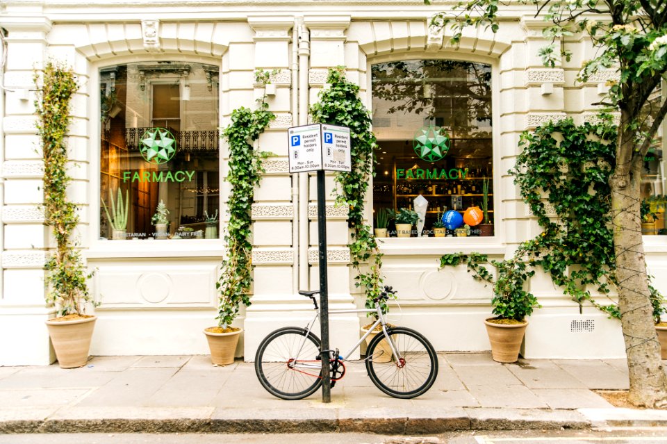 Black And White Bicycle Beside Post