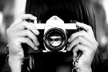 Woman Holding Dslr Camera In Grayscale Photography photo
