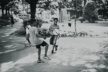 Grayscale Photography Of Kids Playing Ball photo
