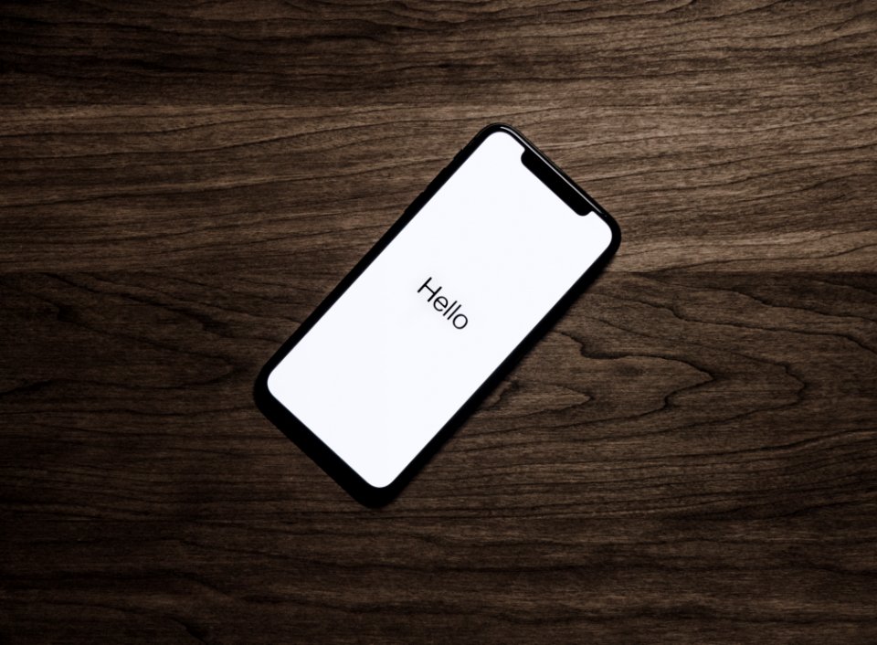 Black Iphone 7 On Brown Table