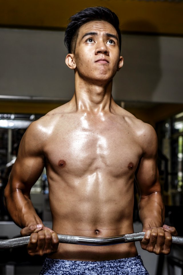 Photography Of Man Carrying Ez Barbell