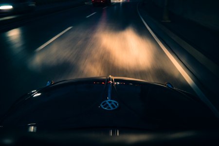 Black Volkswagen Car On Gray Asphalt Road photo