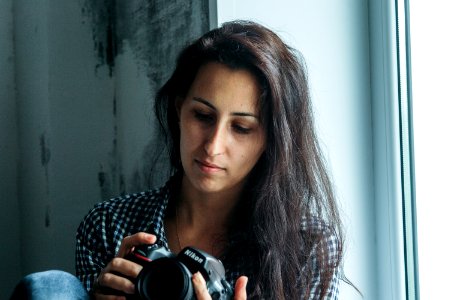 Woman Holding Nikon Dslr Camera photo
