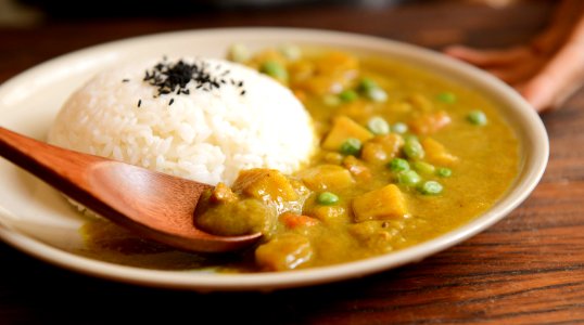 Cooked Rice And Curry Food Served On White Plate photo