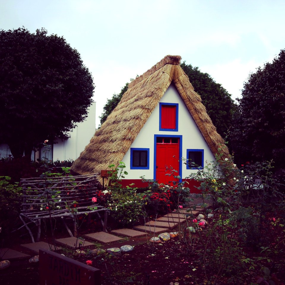 Brown White And Red House Near Garden At Daytime