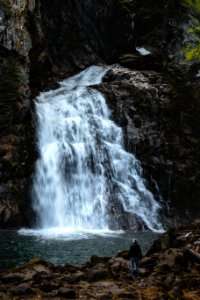 Man Standing Near Waterfalls photo