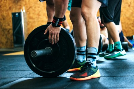 Person Holding Black Weight Plates photo