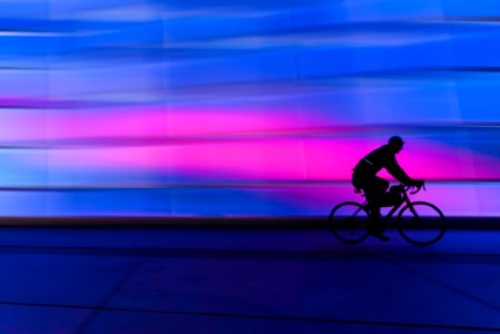 Silhouette Of Person Riding On Commuter Bike photo