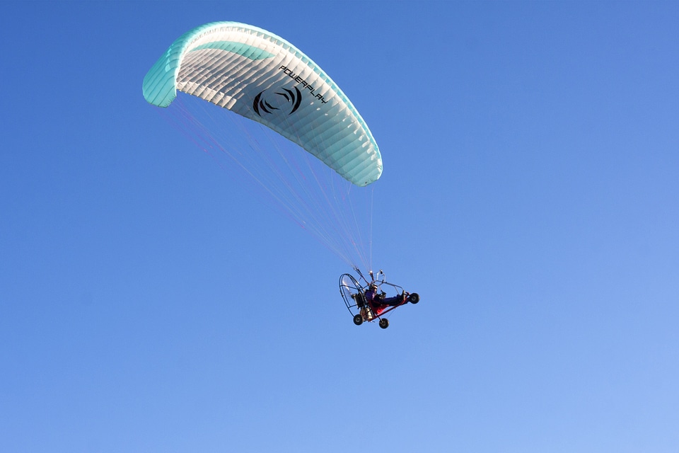 Blue flying hang glider