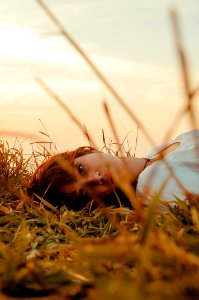 Woman Laying On The Grass