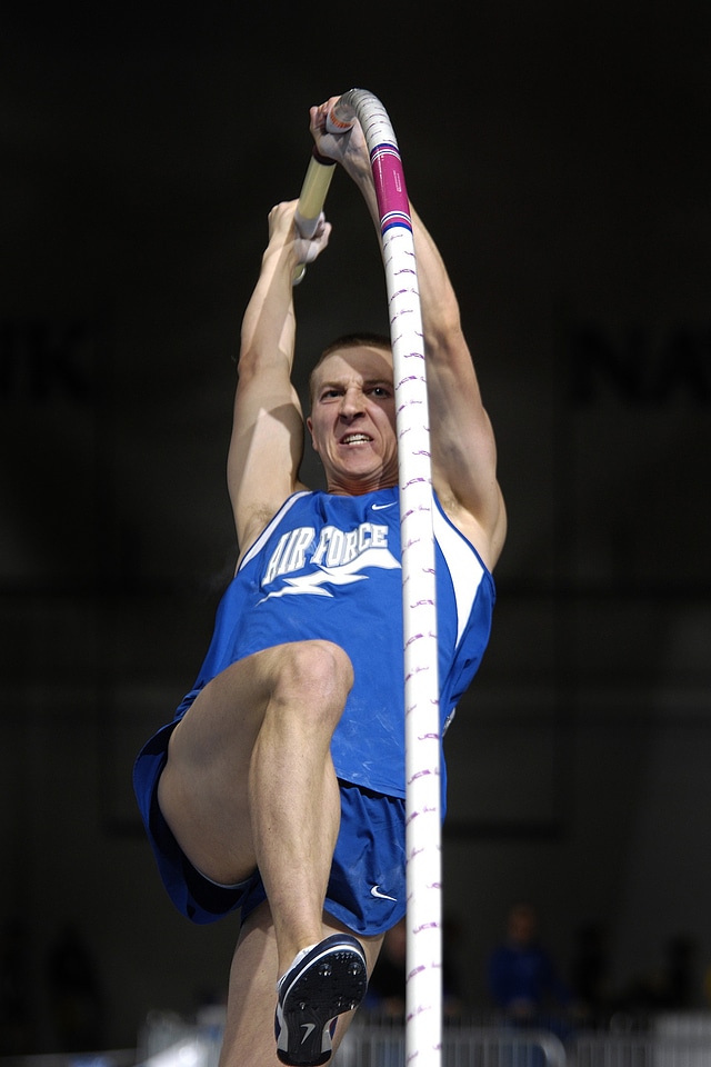 Athletic man vaulting