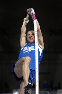 Athletic man vaulting