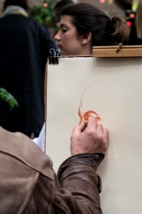 Person Sketching Womans Face