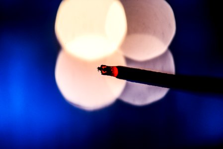 Lighted Cigarette Stick With Bokeh Photography