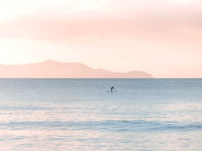Man Rowing A Boat On Sea At Daytime photo