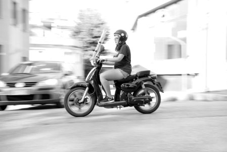 Woman Riding On Scooter Motorcycle photo