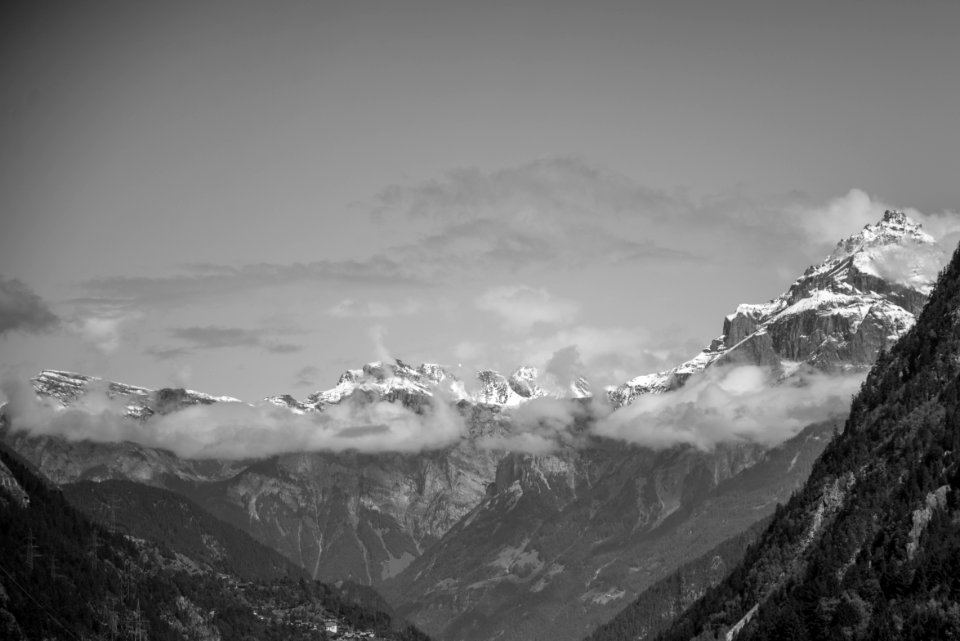 Snow Covered Rugged Mountain With Mist Photograph photo