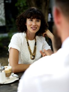 Woman In White Dress Shirt Posing For A Photo photo