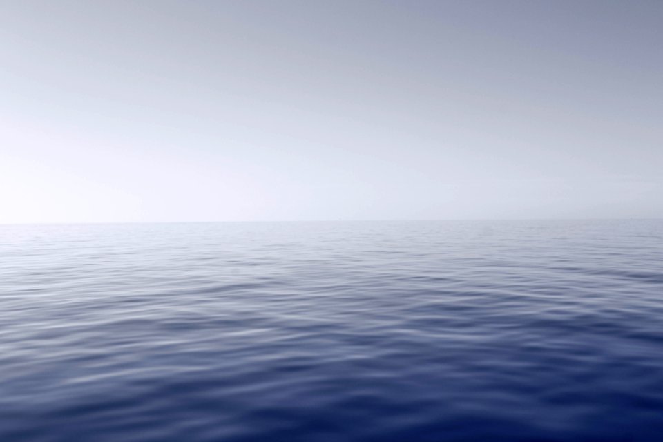 Blue Body Of Water With Fog