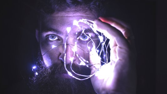 Person Holding String Lights Photo photo