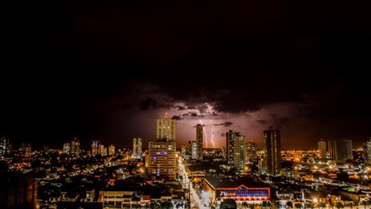 Thunderstorms Above City During Night Time photo