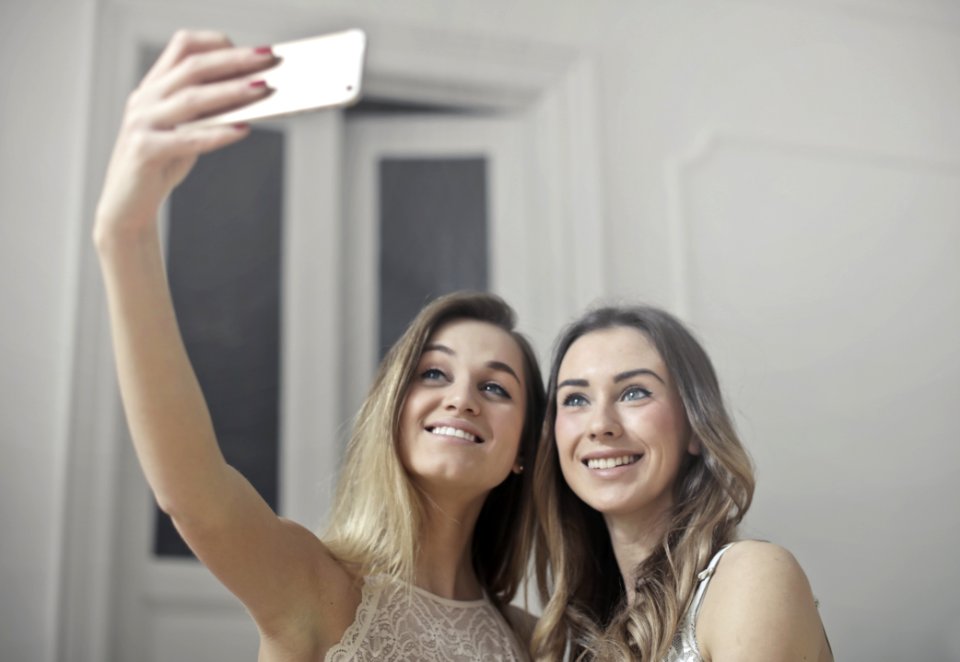Photo Of Women Taking Picture