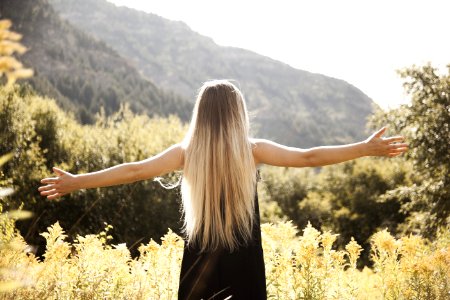 Standing Man In Black Dress Facing Mountain photo