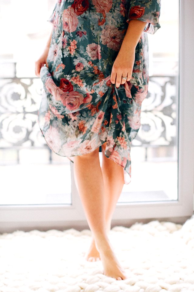 Woman Wearing Blue And Brown Floral Dress