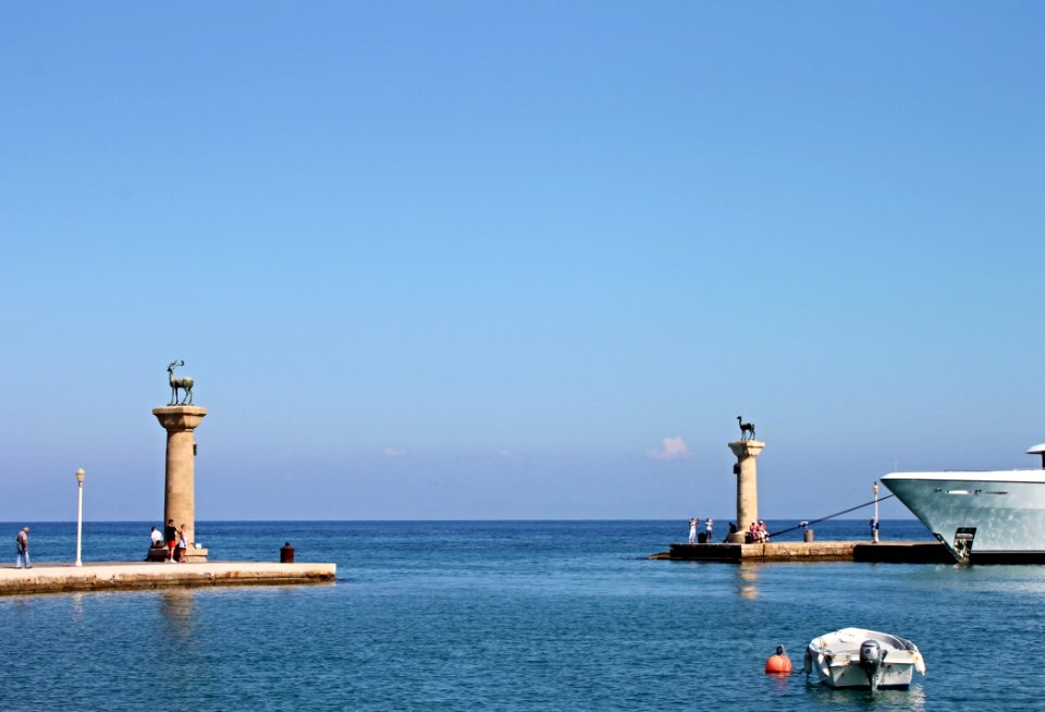 Sea Lighthouse Calm Sky photo