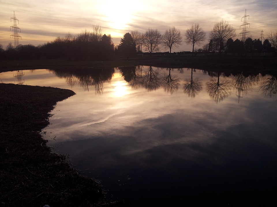 Evening sun mirroring landscape